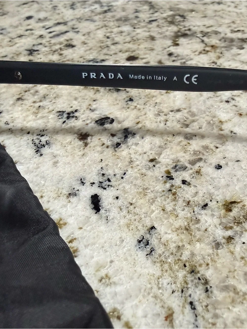 Prada Black Frame Sunglasses with Dark Lenses